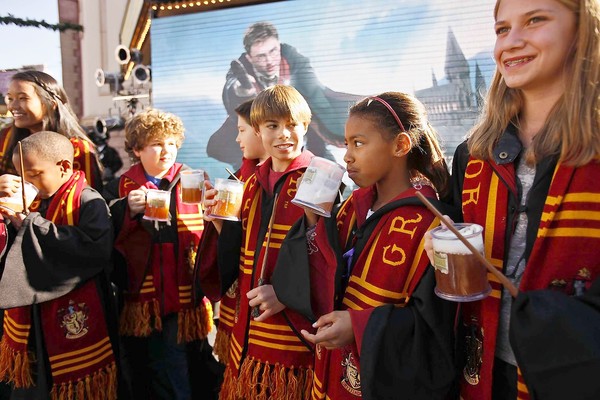 Children drinking butterbeer at the Tuesday news conference (courtesy of latimes.com).