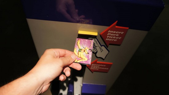 FastPasses at Walt Disney World: Admission ticket goes in, FastPass comes out.