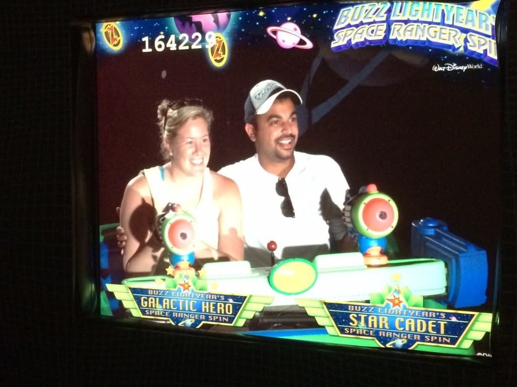 Photo of me and my wife in Buzz Lightyear's Space Ranger Spin ride.