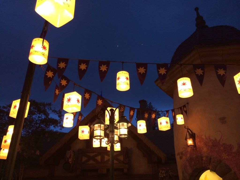 Lanterns hanging from strings in Fantasy Land at night.