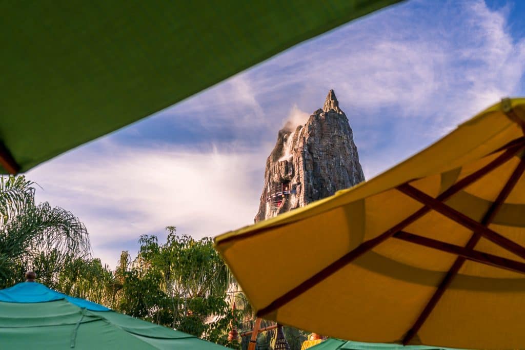 Peeking through Waturi Beach umbrellas towards Krakatau