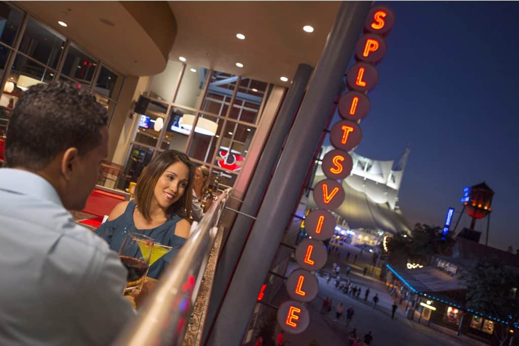 Photo of two people enjoying a drink at Splitsville in Disney Springs.