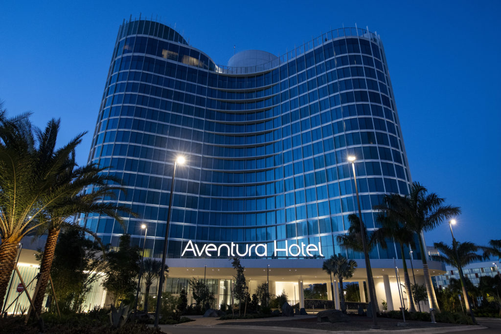 The unique curved shaped of Aventura Hotel at Universal Orlando Resort at twilight