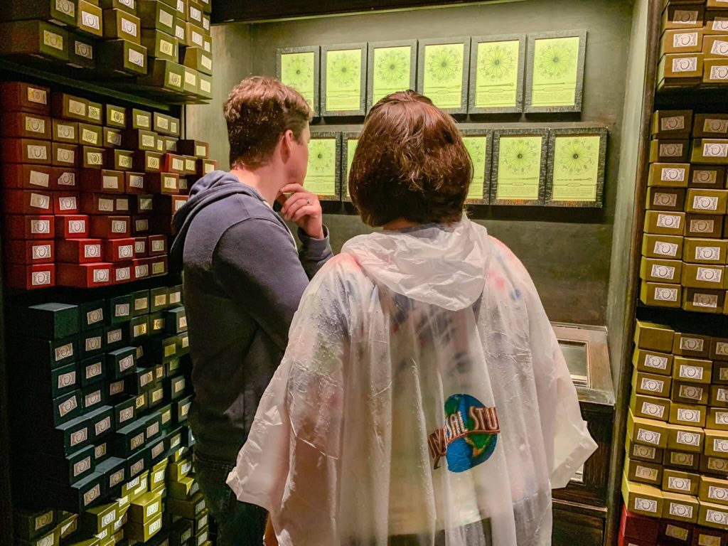 Choosing wands at Ollivander's at The Wizarding World of Harry Potter - Diagon Alley