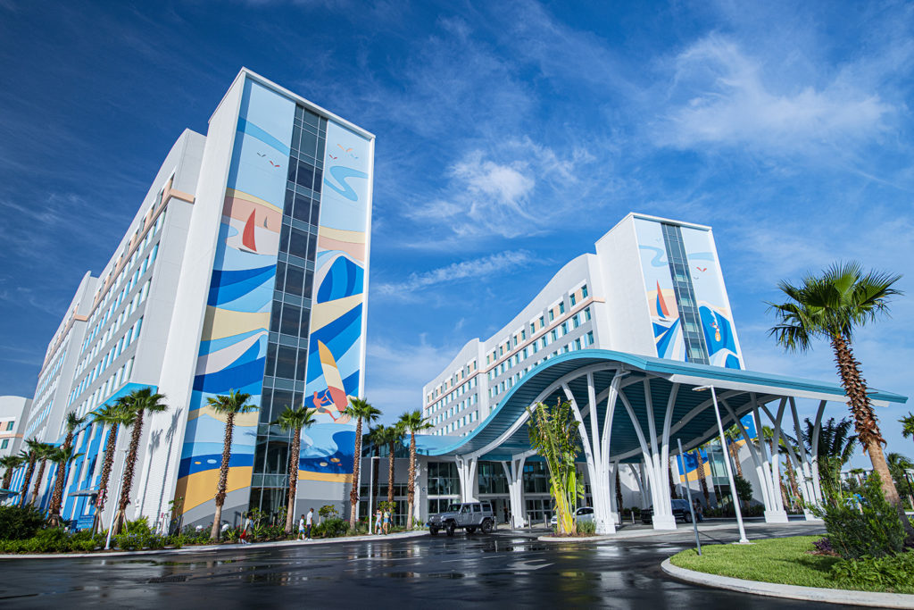 Endless Summer Resort - Surfside Inn and Suites driveway and front entrance with design features including surfer murals and wave-shaped porte-cochère