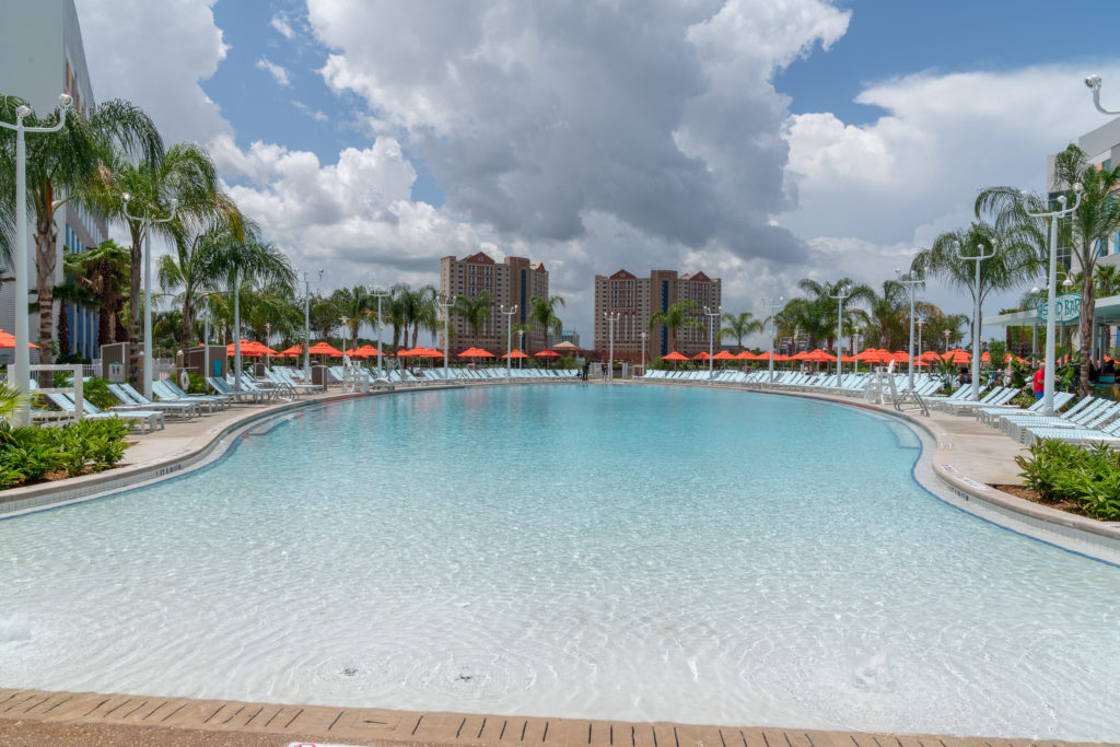 Relax at the zero-entry surfboard-shaped pool at Surfside Inn and Suites