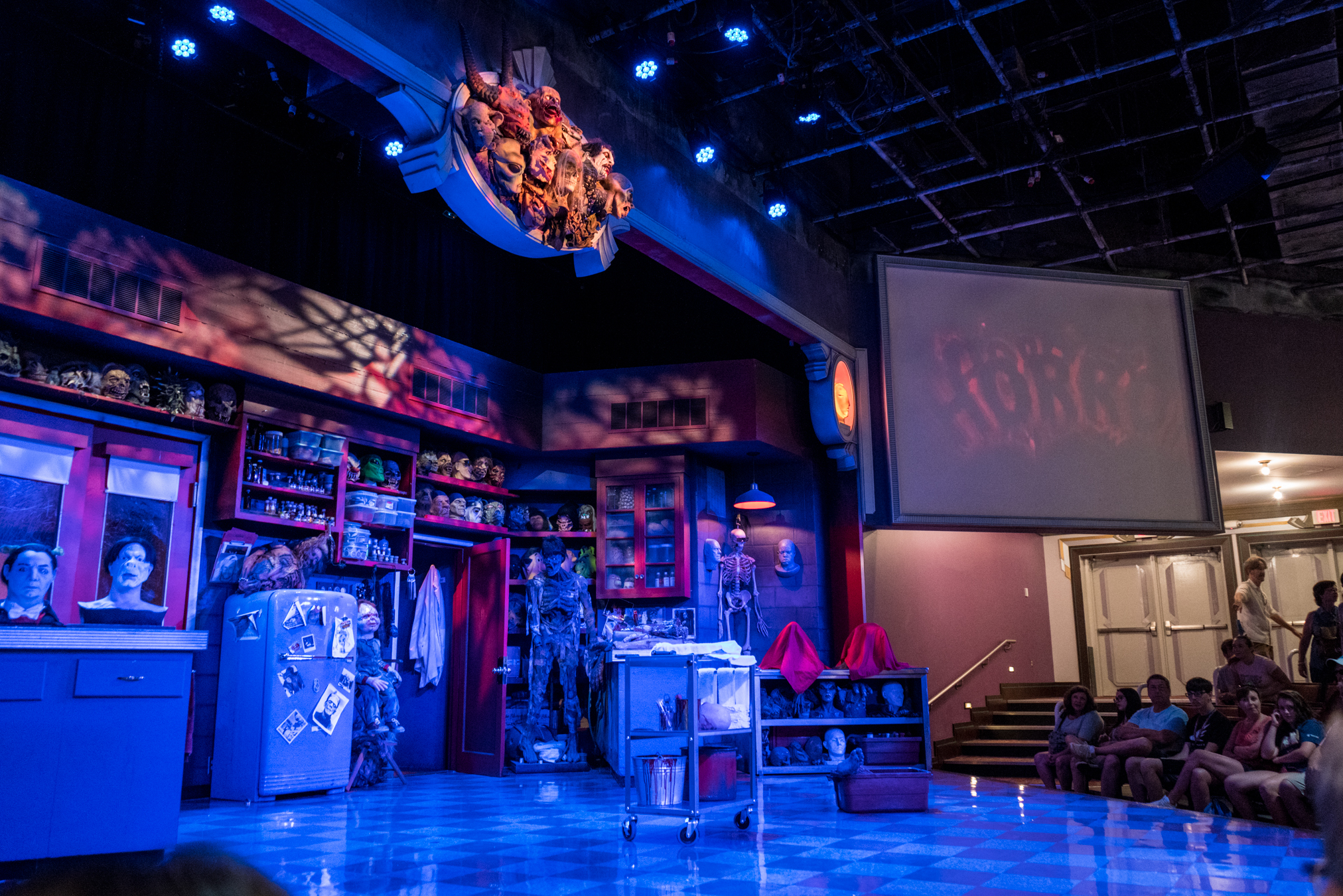 The stage for Universal Orlando's Horror Make-Up Show resembles a creative laboratory with lots of props and prosthetic masks from famous horror films