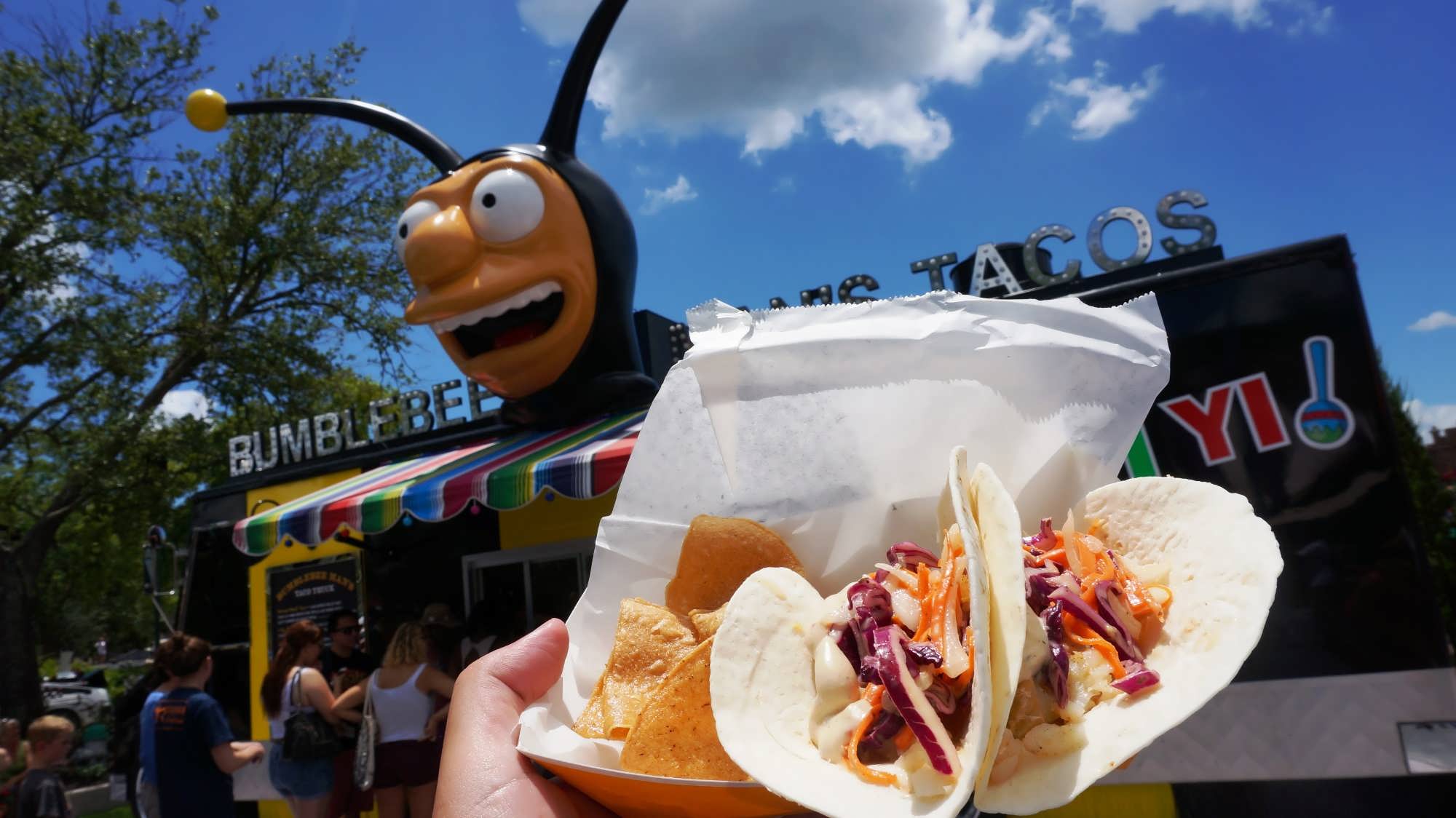 Two tacos and tortilla chips from Bumblebee Man's Taco Truck