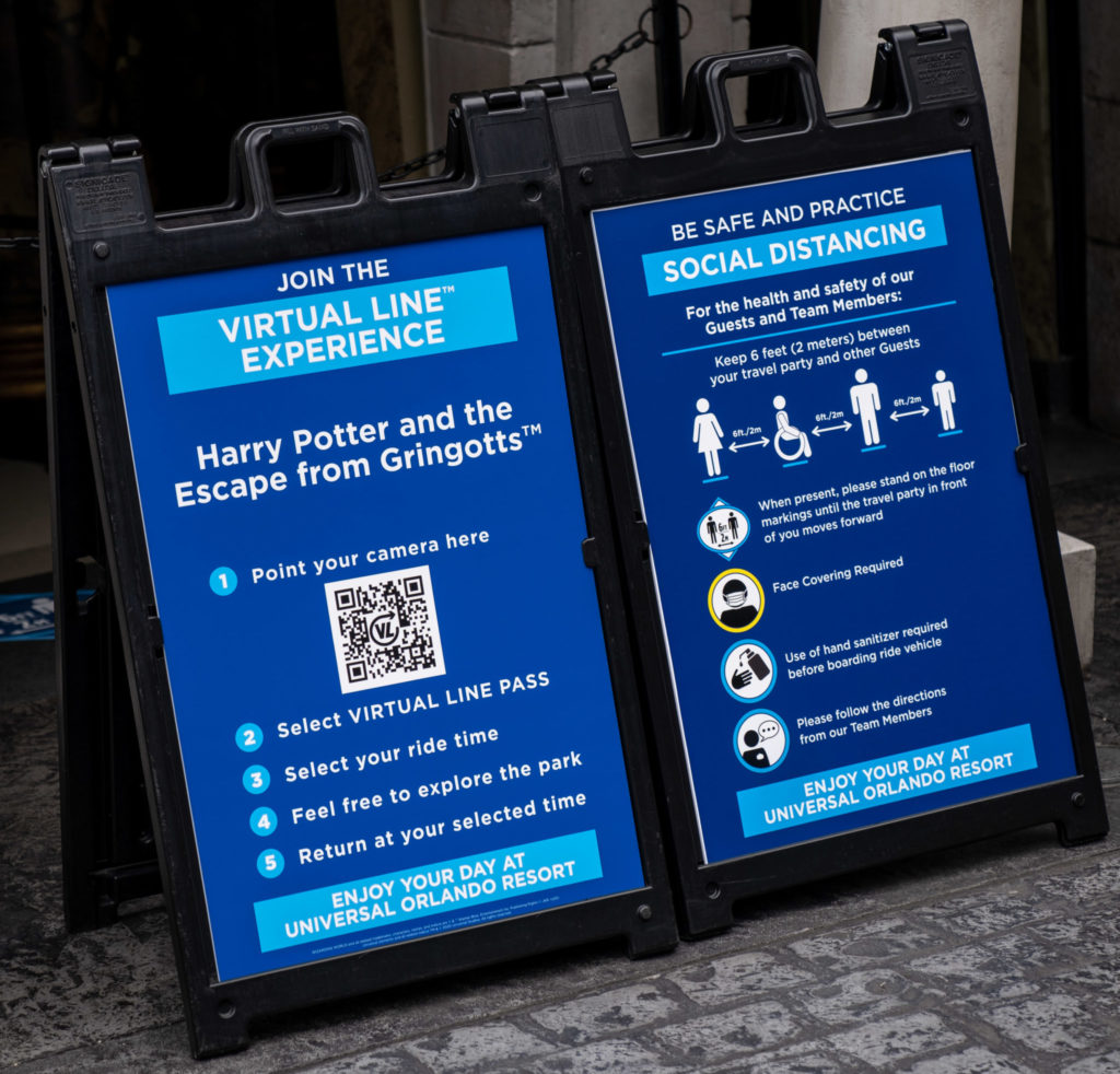 Signs detailing the virtual line experience at Universal Orlando Resort