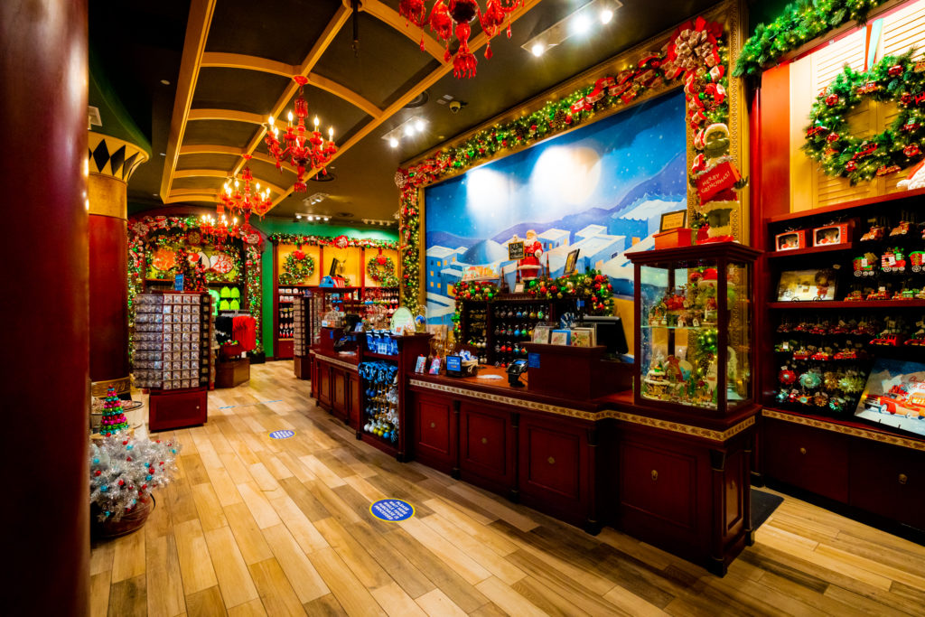 Festive decor and merchandise adorn the checkout desk at the Christmas Shoppe