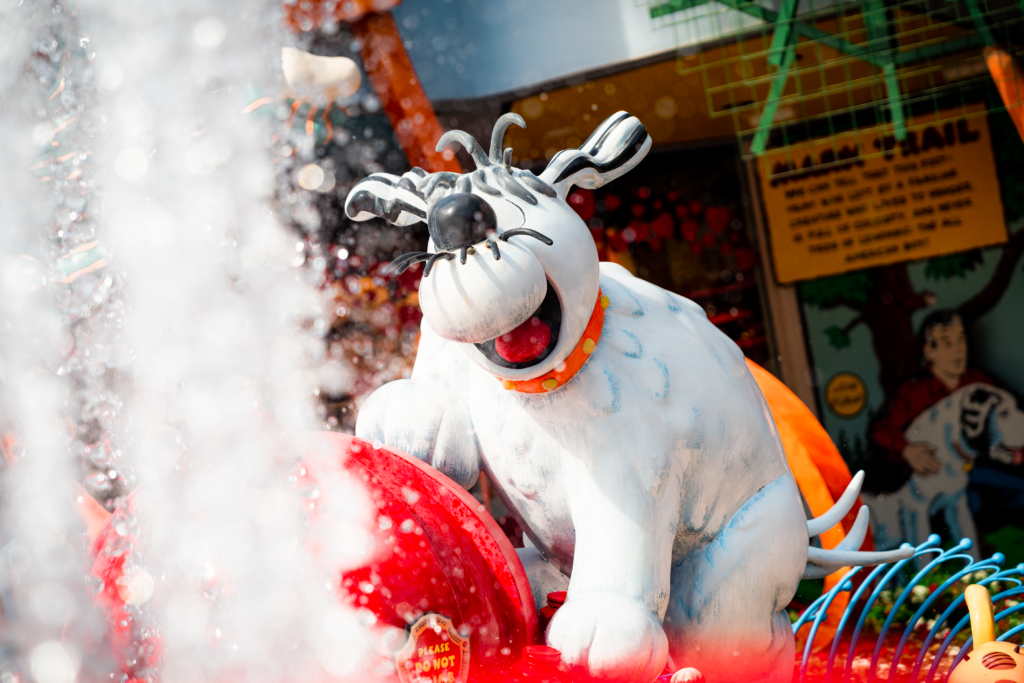 Comic dogs frolic around the fire hydrant in Toon Lagoon, Islands of Adventure