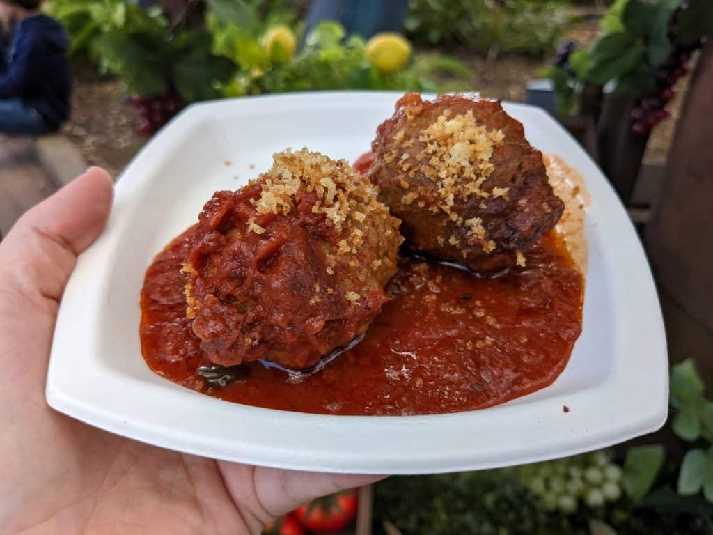 Homemade meatballs with Fontina Cheese and fresh herbs in Pomodoro sauce garnished in Garlic Panzito