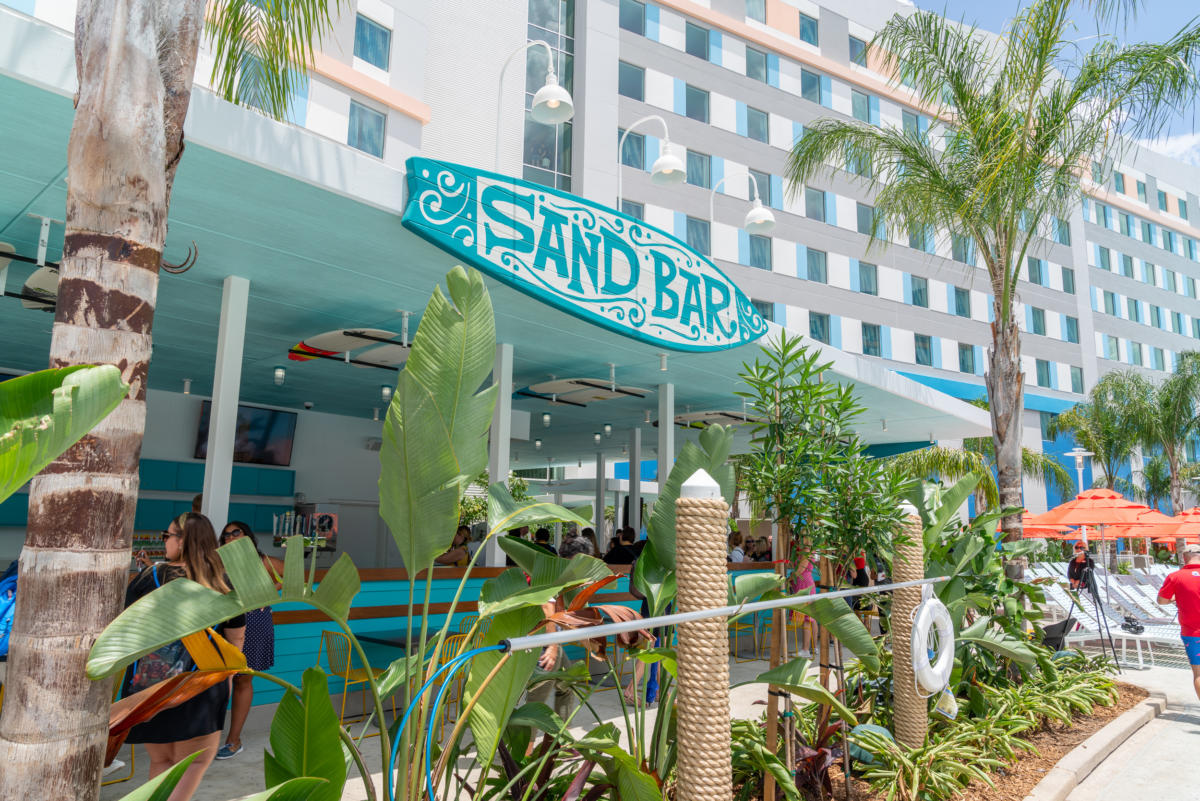 Surfboard-shaped sign at the entrance to Sand Bar