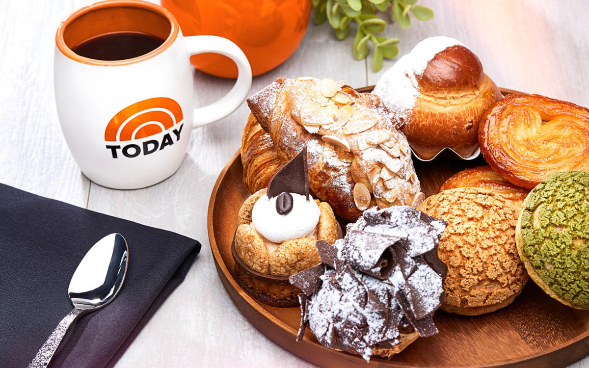 a plate of pastries and a mug of coffee from Today Cafe at Universal Studios Florida